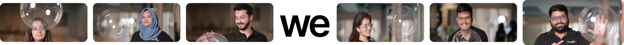 Team members in Hola Prime smiling and playing with transparent bubbles indoors — tech company culture and diversity.